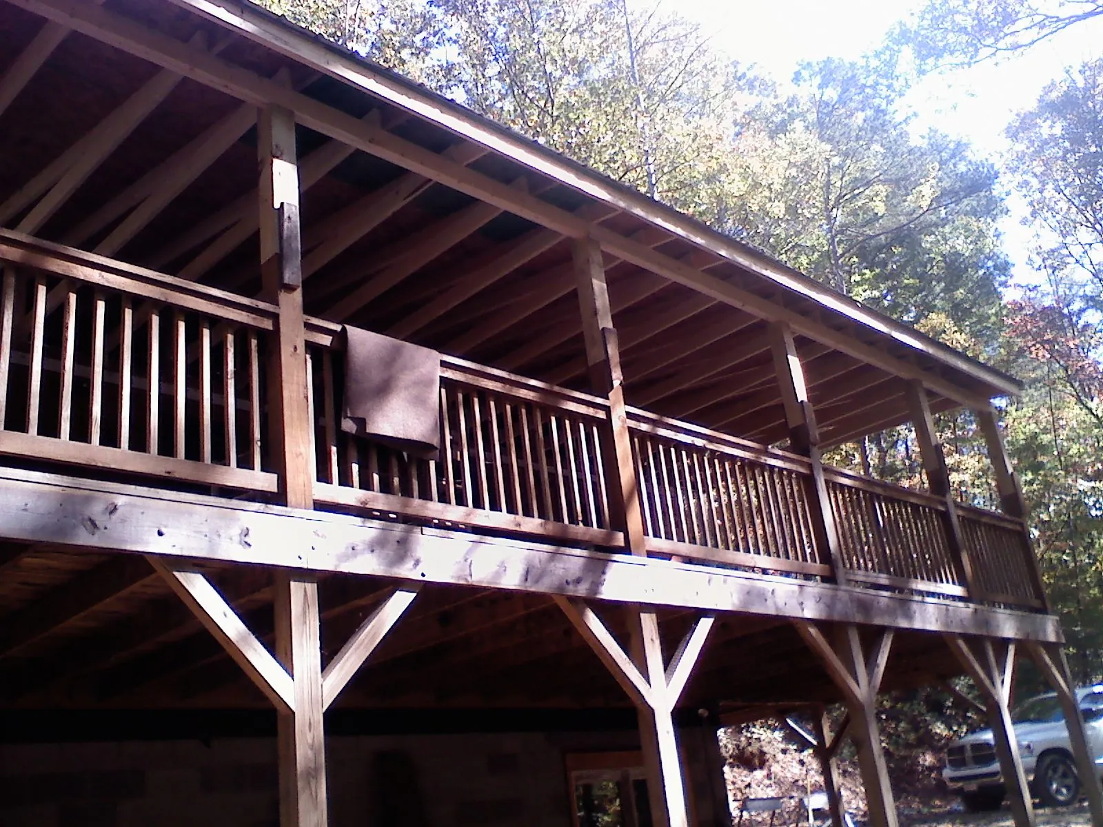 Timber framing under a new elevated porch and deck — Roof Leak Repair in Rumford by Roofing Brothers